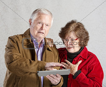 Embarrassed Man with Tablet