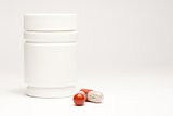 medical pills in laboratory near white container