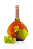 Wine bottle with wine grapes and grape leaves.