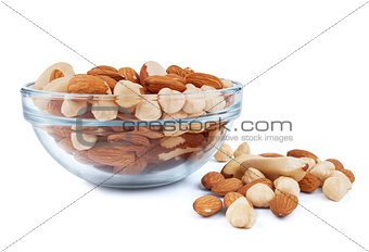 nuts d in a glass bowl isolated over white background