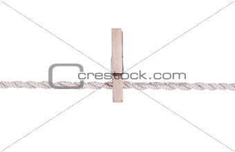 wooden clothespin on a rope. Isolated on white.