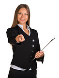 Businesswoman holding paper holder and indicate forward
