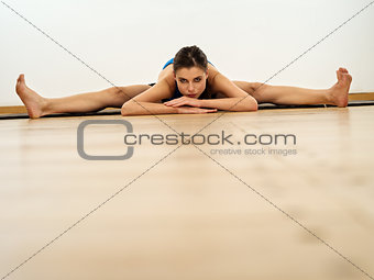 Flexible woman doing the splits