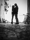 Silhouette of lovers kissing