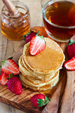 Pancakes with strawberry and honey