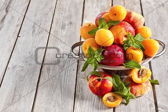 Apricots, nectarines and saturn peaches background