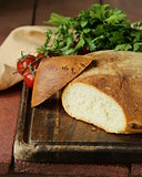 traditional Italian ciabatta bread with tomatoes and herbs