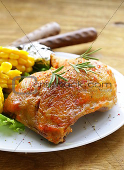 baked chicken leg with corn for garnish