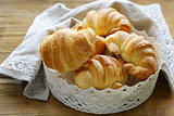 traditional French baking puff pastry croissants in lacy basket