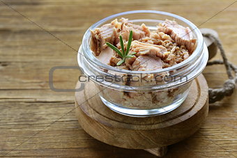 canned tuna with rosemary in a glass jar