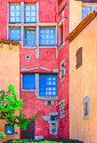 Detail of nice colorful wall with doors and windows, Sardinia