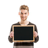 Man holding a chalkboard