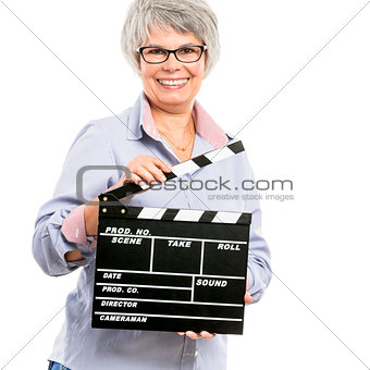 Elderly woman holding a clapboard