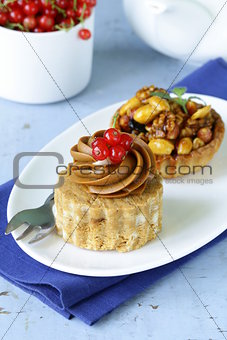 small dessert pastries with nuts and berries for tea time