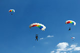 unidentified skydiver on blue sky