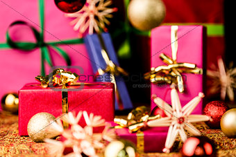 Red Present among other Gifts and Baubles