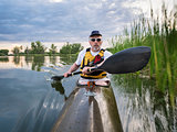 paddling sea kayak on a lake