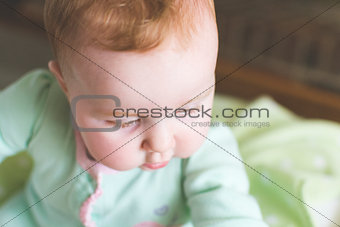 Close-up of cute baby in crib