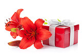 Red lily flower and gift box