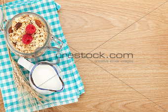 Healty breakfast with muesli, berries and milk