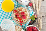 Healty breakfast with muesli, berries and orange juice