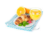 Orange juice and fresh croissant