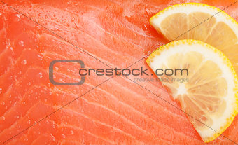 Fresh salmon fish with lemon slices