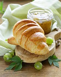 Breakfast croissant with fresh jam of green gooseberry