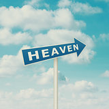 Road sign pointing to heaven