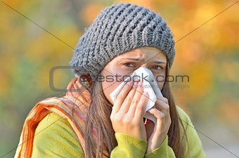 girl blowing nose