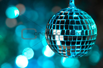 Blue disco ball on bokeh background - horizontal