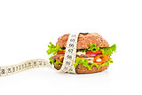 Sandwich with measuring tape. Fitness concept.