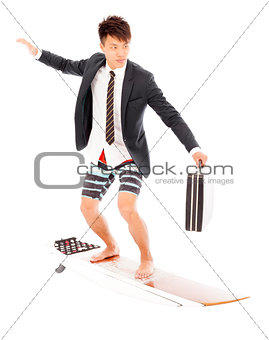 business man holding a briefcase and standing surfing board