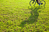 man riding on a meadow with shadow 