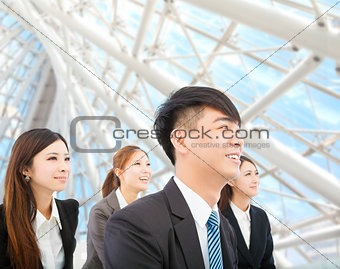 young businessman and businesswoman stand in the modern office
