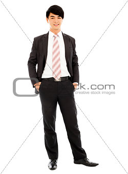 young businessman standing and hands on pocket