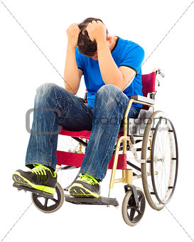 depressed  and handicapped man sitting on a wheelchair 
