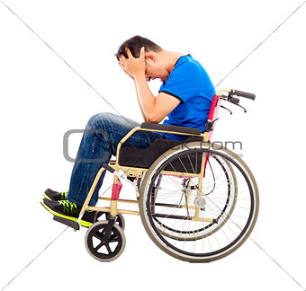 upset  and handicapped man sitting on a wheelchair 