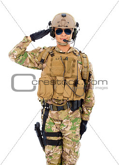 Soldier in military uniform  saluting over white background