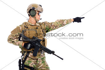 Soldier holding rifle or sniper and directing