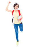 happy young student girl raising a hand with book