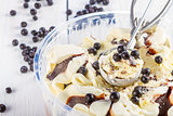Vanilla and chocolate ice cream with blackberries