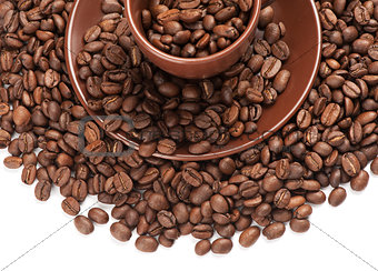 Coffee cup and beans on a white background