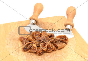 Chopped soft dried figs with a rocking knife