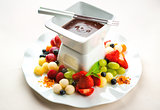 Chocolate fondue with fresh fruits and berries