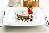 Sliced foie gras with sauce and chanterelle mushrooms 