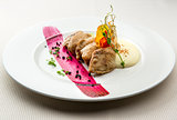 Quail breast with potato puree and blackcurrant sauce