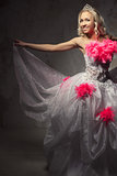 Lovely woman wearing white dress decorated with pink feather boa