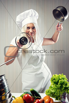 Woman cook wearing uniform posing indoors