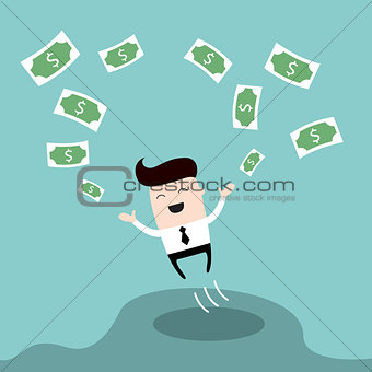 Happy businessman jumping surrounded by money